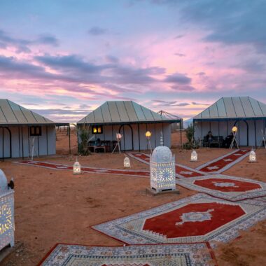three houses near outdoor light during daytime